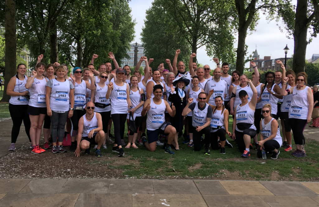 A group of runners and WISHH Trustee Sue Stevenson