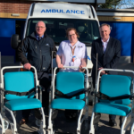 Portering team with wheelchairs and ambulance