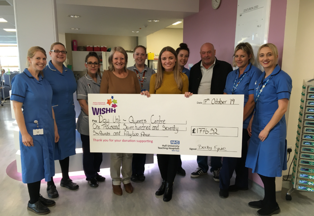 Fundraiser Becky Fyvie presents a cheque to nurses