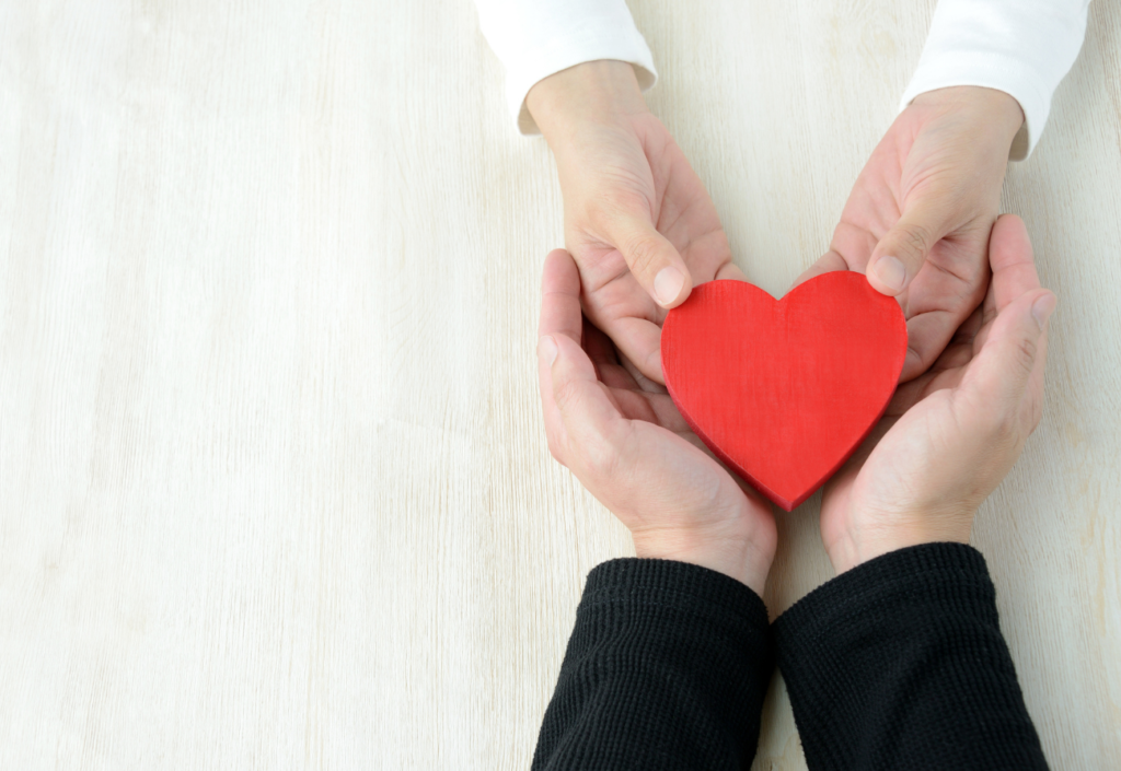 Hands hold a love heart