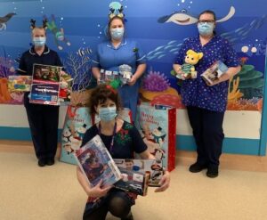 Charity Manager Lisa deliverts toys to Ward 130